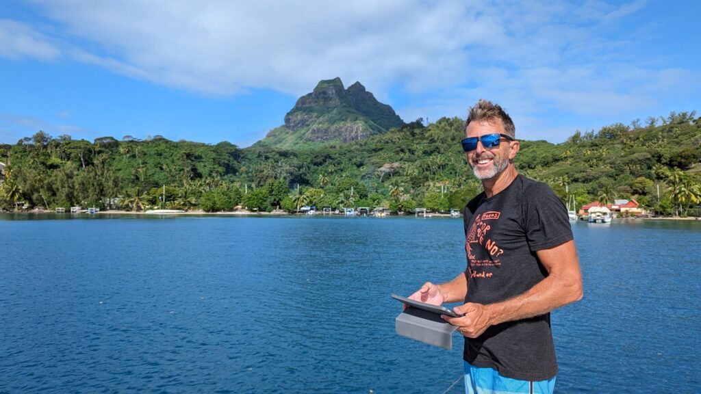 Pat in French Polynesia, balancing work and play.